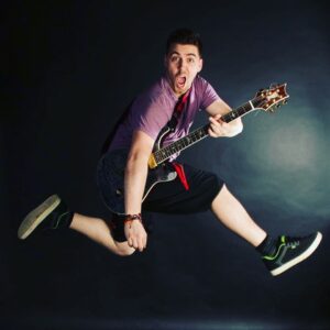 guitar ninja lessons teacher rory price on stage - electric